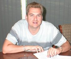 G Schaefer Happy Buyer Photo of client signing closing documents